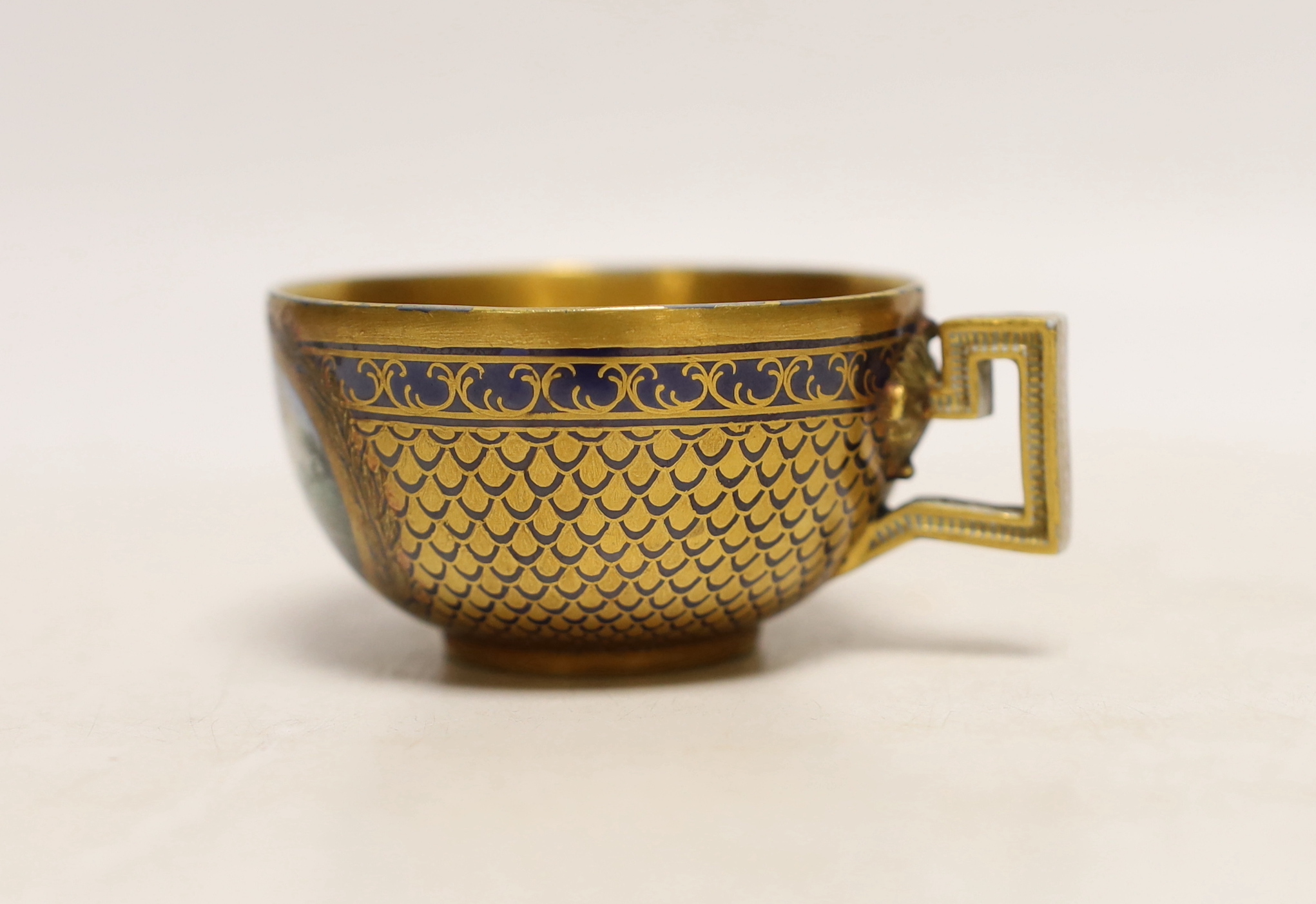 A Meissen Marcolini period cabinet cup, hand painted with figures beneath a tree and gilded interior, crossed sword mark to the base, 8.5cm wide